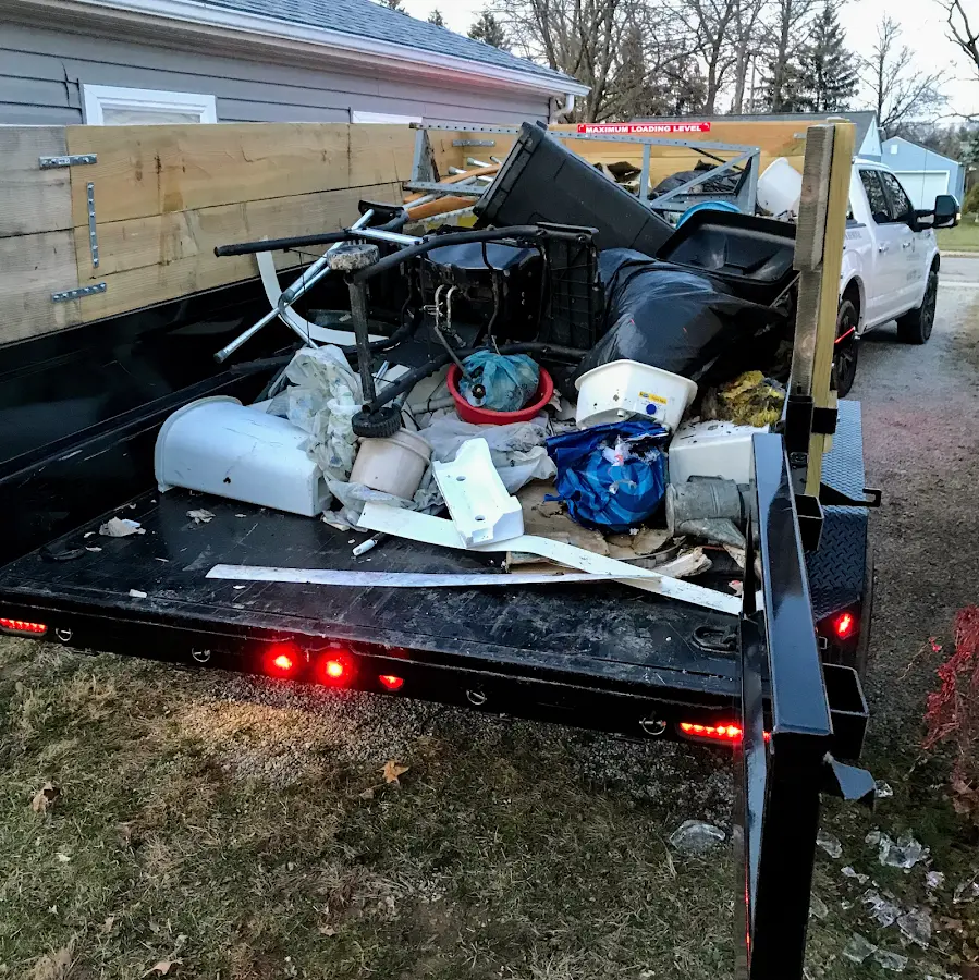 Roll-off dumpster delivered to a residential driveway in Hampstead